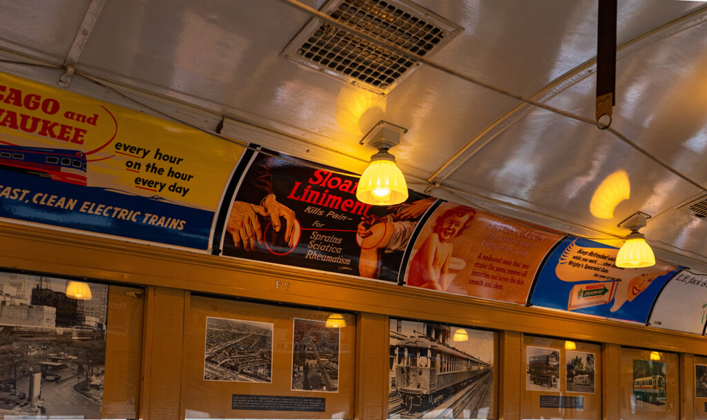 The inside of the 4000-series with incandescent light bulbs casting a yellow glow over the interior of the cars.